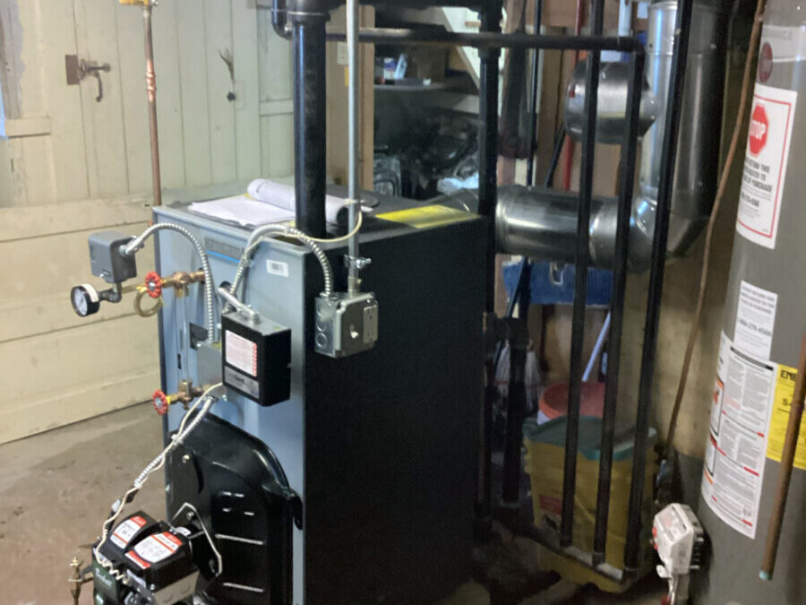 A steam boiler in a brightly lit basement.